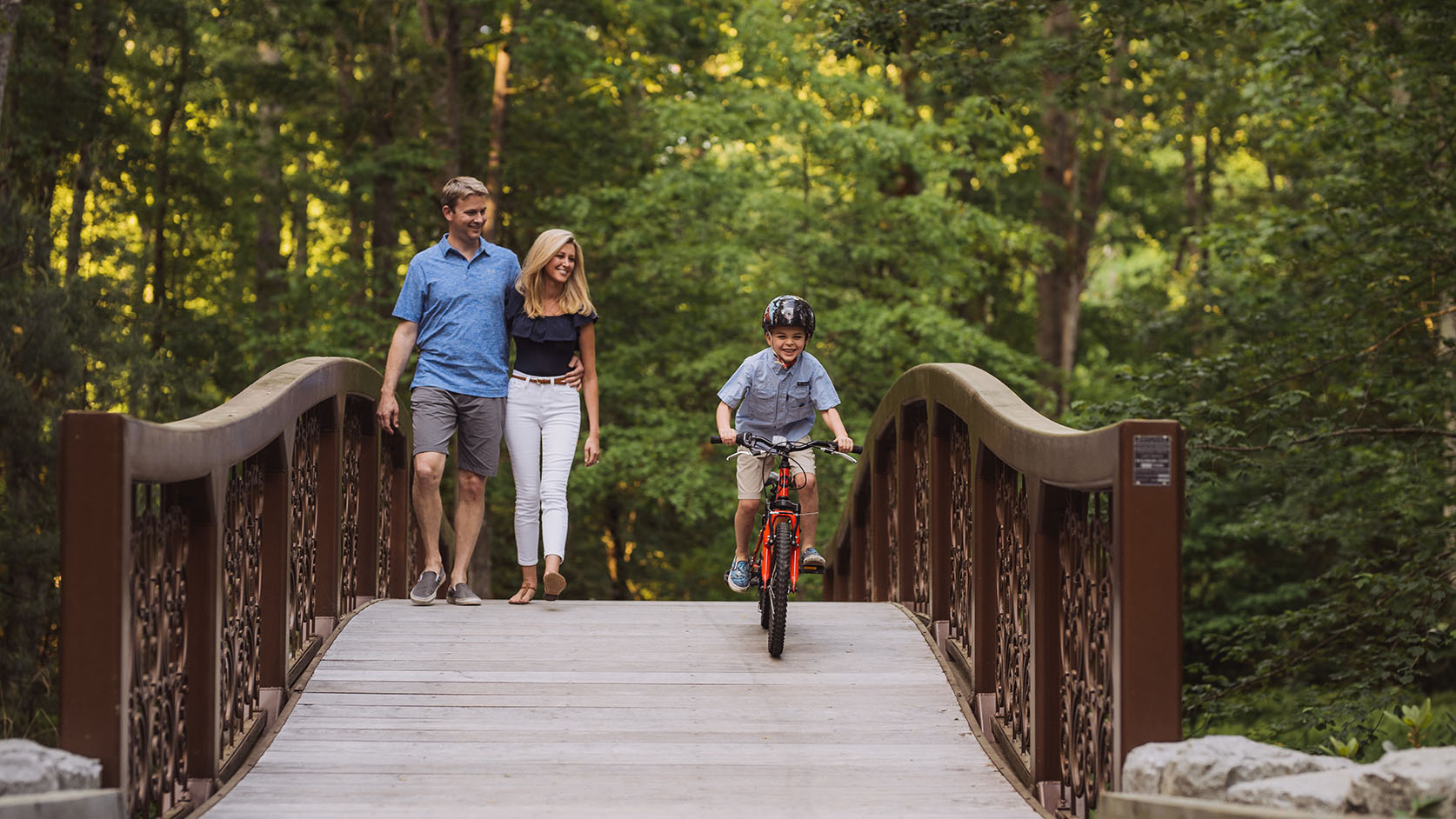 A family on Bow Bridge in The Ramble